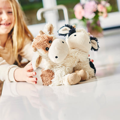Warmies® Fully Microwaveable Warm Hugs Cows, Heatable Soft Cuddly Teddy With Relaxing Lavender Scent