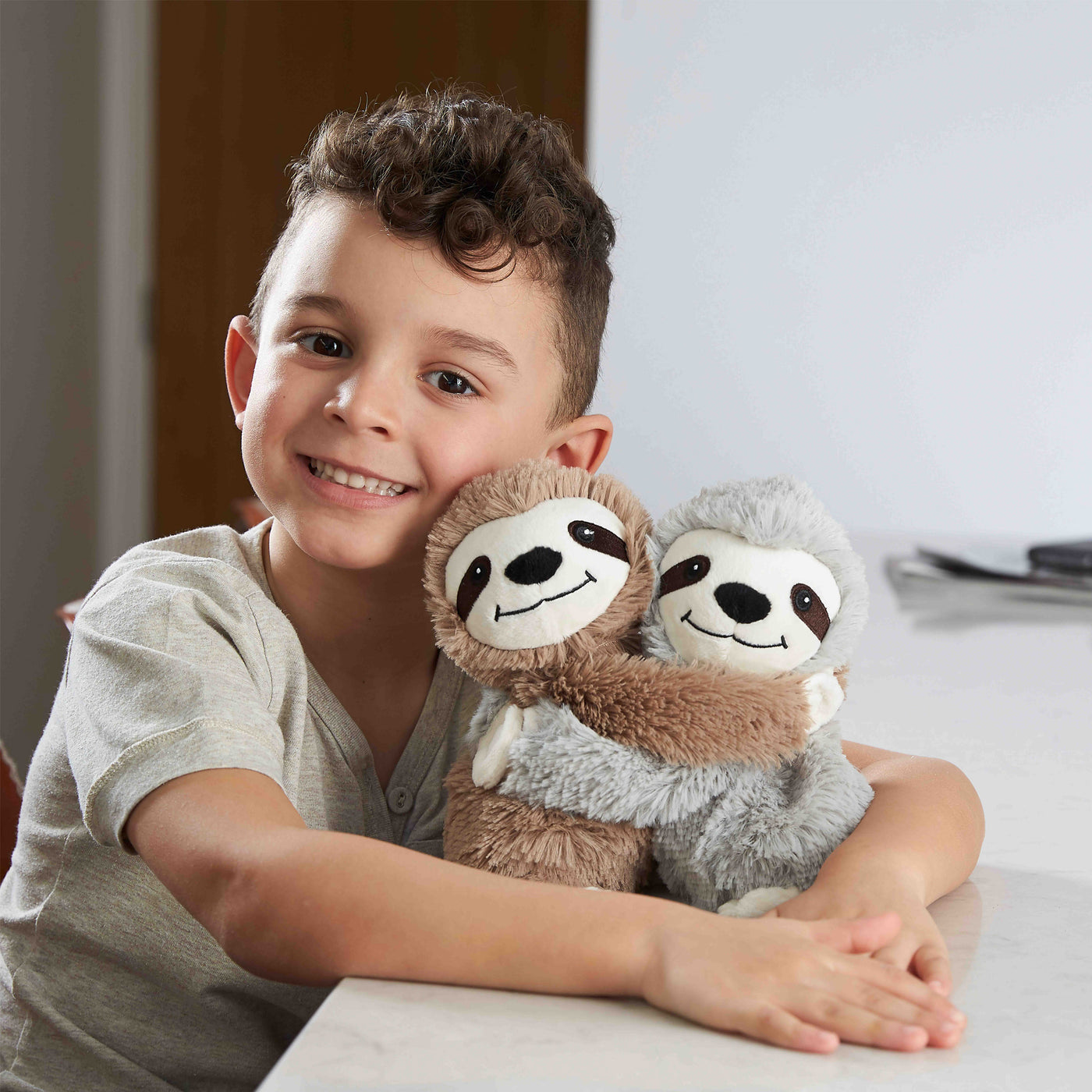 Warmies® Fully Microwaveable Warm Hugs Sloths, Heatable Soft Cuddly Teddy With Relaxing Lavender Scent